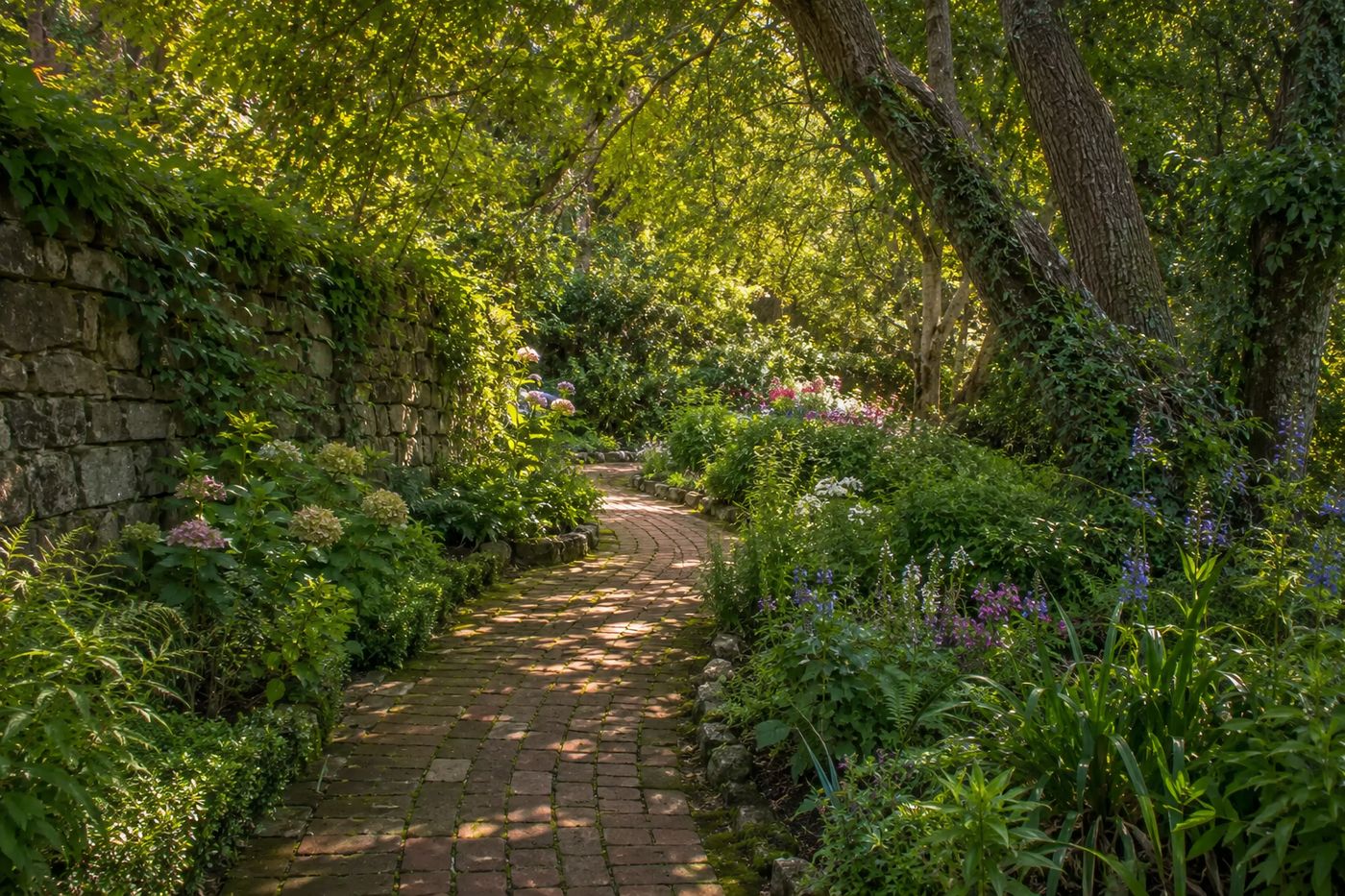 A lush storybook garden path in a historic Pasadena, California neighborhood