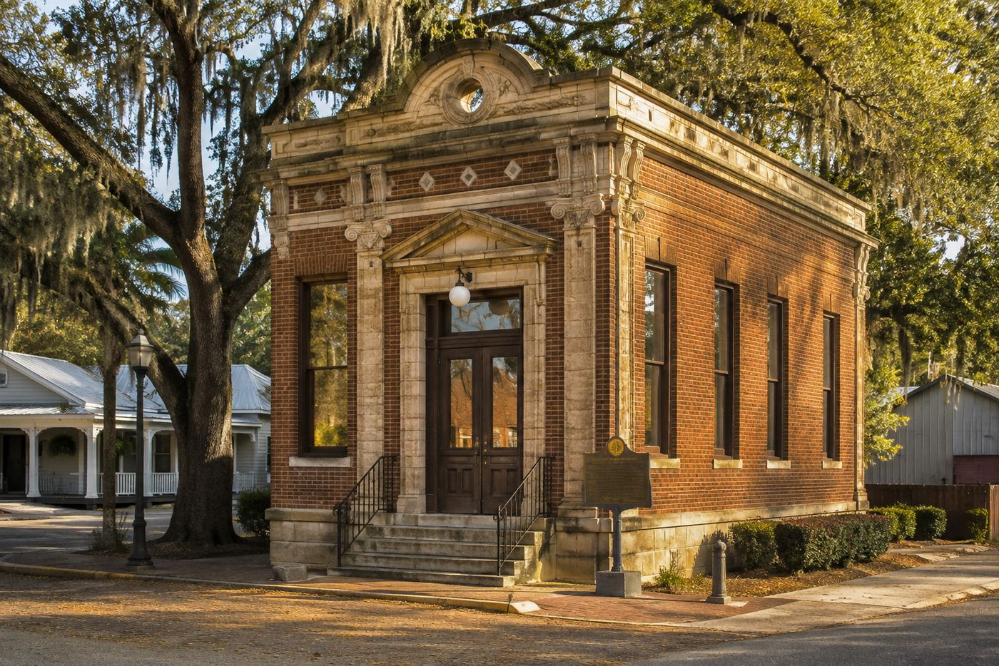 A small historic brick bank building in a rural Louisiana town