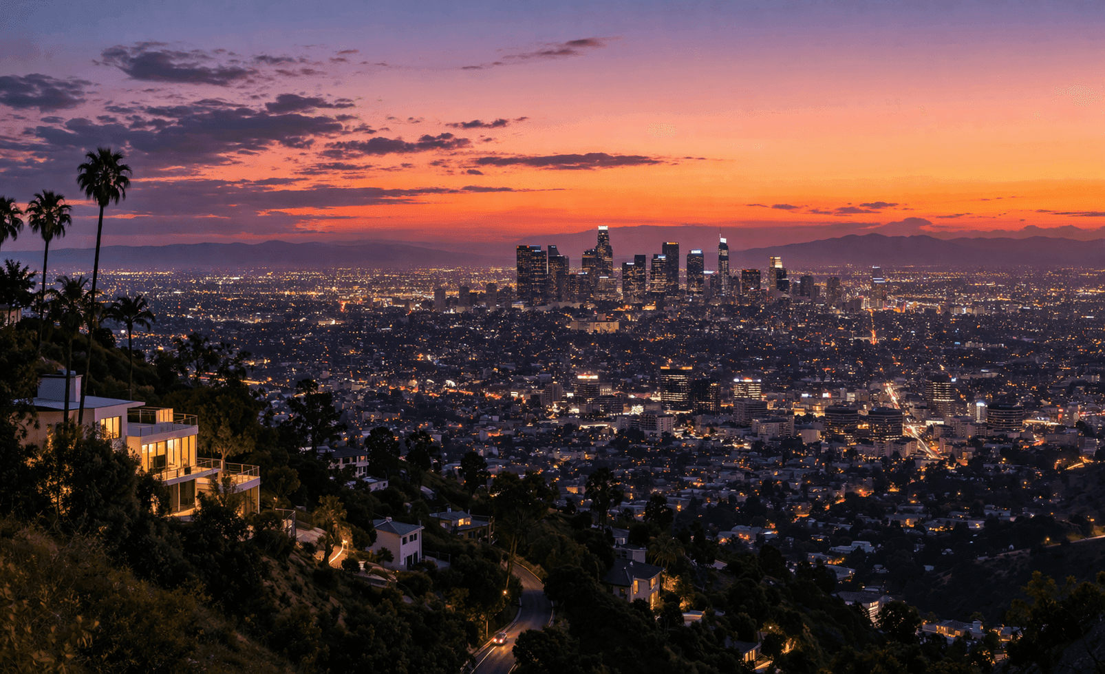 Panoramic view of Los Angeles from the Bel Air hills at dusk, with the city lights spreading across the basin below.